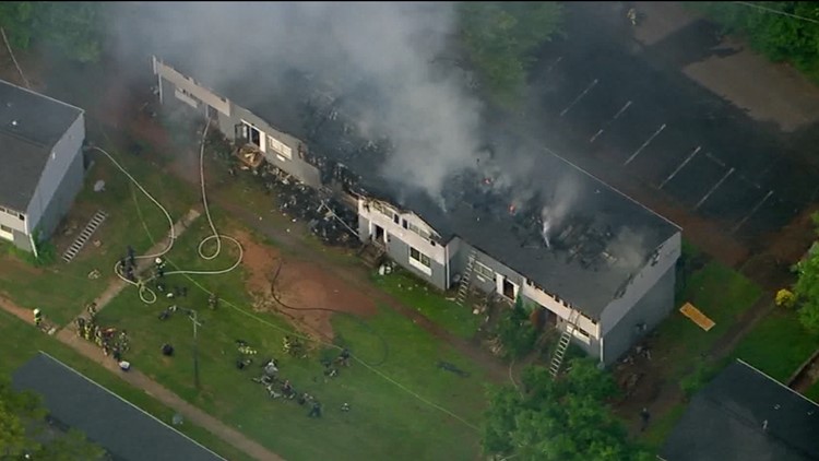 ​Firefighters work to put out flames at Decatur apartment complex