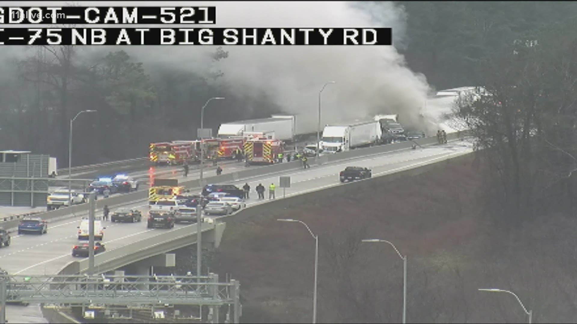 At least one person was killed in the wreck with the northbound lanes of I-75 near Chastain Road blocked for more than five hours.