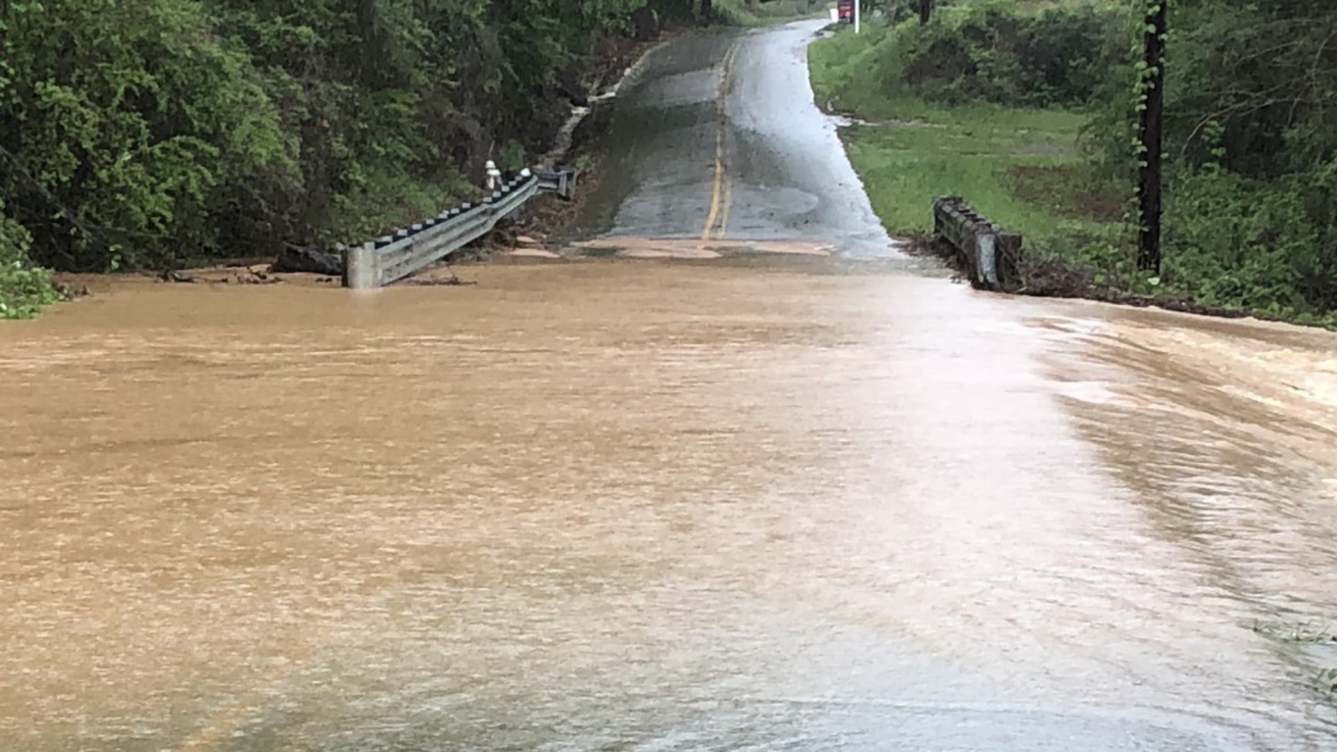 Severe flooding washes away Conyers driveway, shuts down roadways