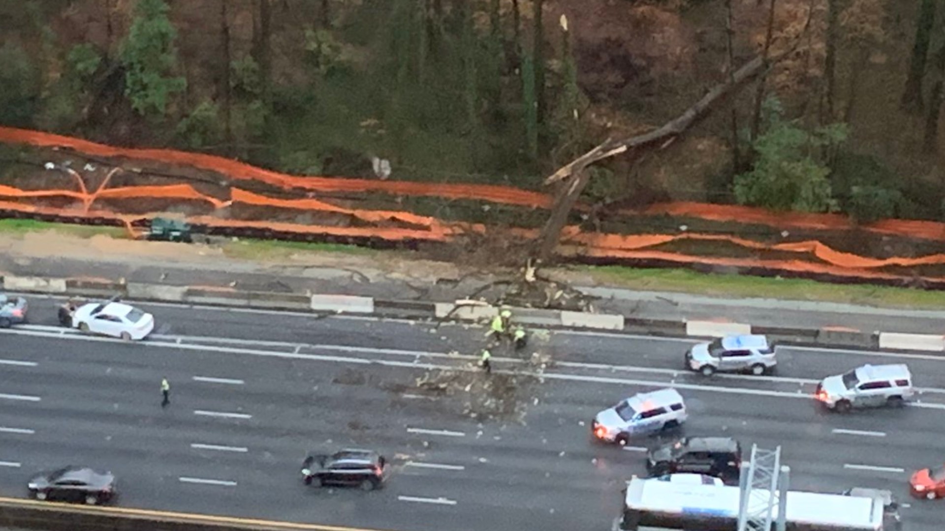 A car was damaged when a tree fell on I-285 during severe weather.