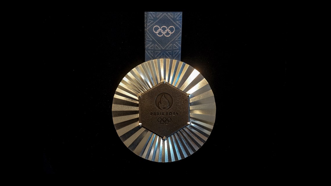 The Paris Olympics medals are monumental. They're embedded with pieces ...