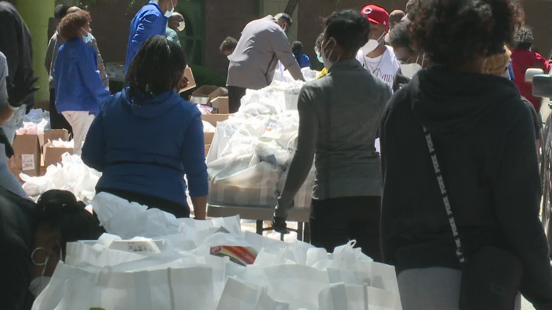 Mayor Bill Edwards and others spent their Thursday handing out bags of food to a steady stream of cars.