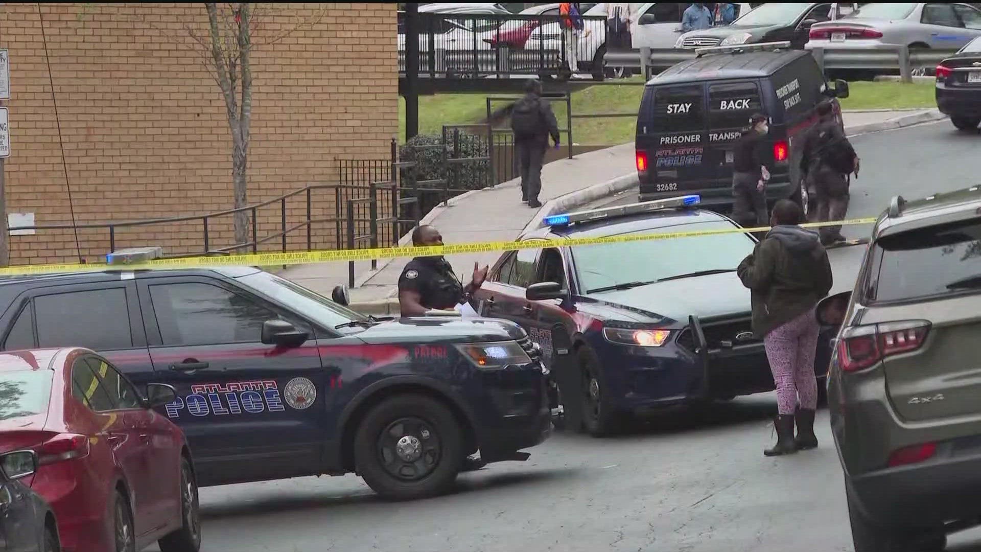 One person is dead and three other people were hurt after a shooting at an apartment complex near a school Monday afternoon, Atlanta Police said.