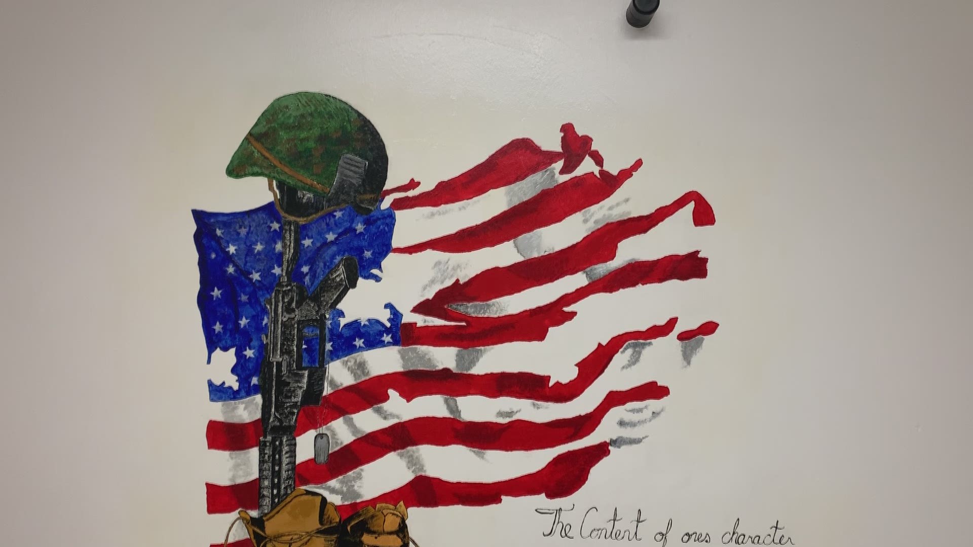 Gwinnett inmates paint Barracks unit with military murals
