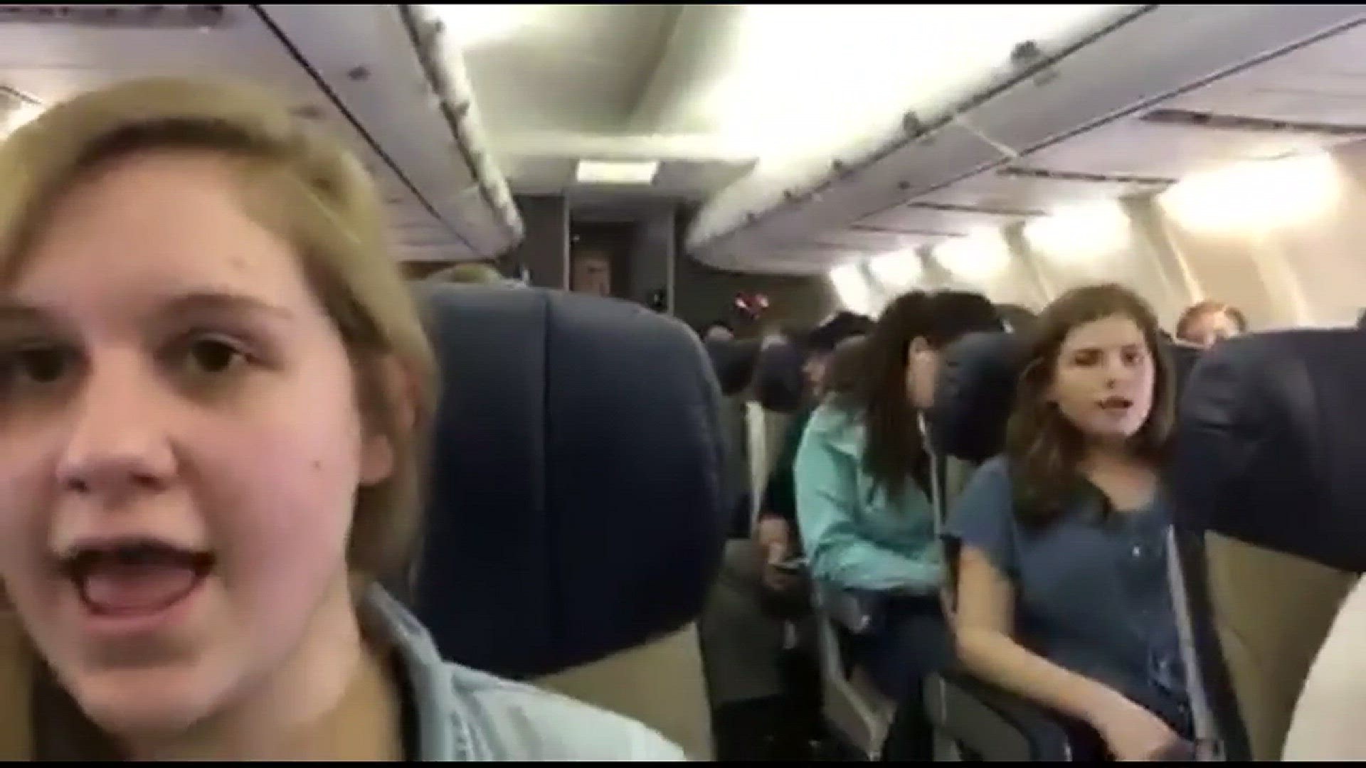 Mona Shores choir sings away airport blues